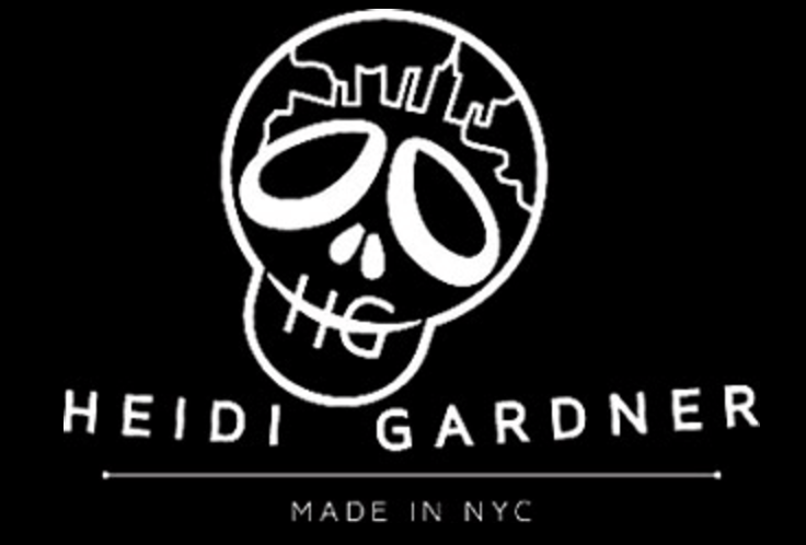 Black and white logo with stylized skull and text.