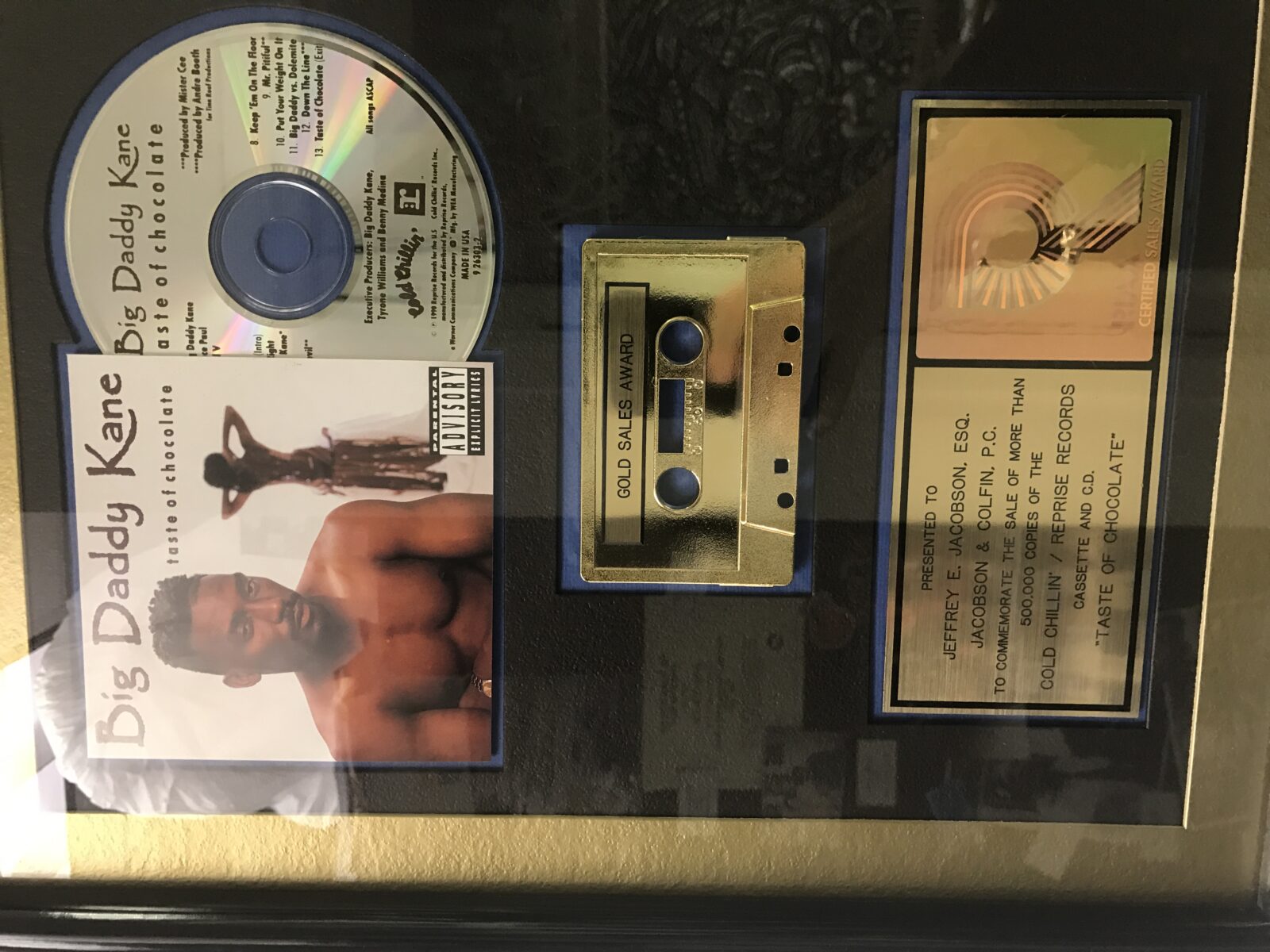 A vintage music cassette tape, CD, and cover featuring an artist.