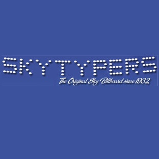 Logo of SKYTYPERS with text in dotted style on blue background.
